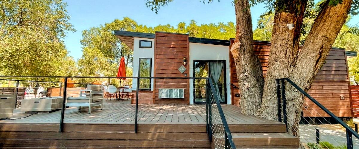 The Magnolia one bedroom tiny home featuring a large bedroom with space for a king-size bed.